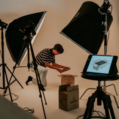 Studio Shot of a Man Unboxing a Package