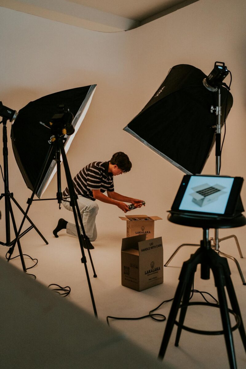 Studio Shot of a Man Unboxing a Package