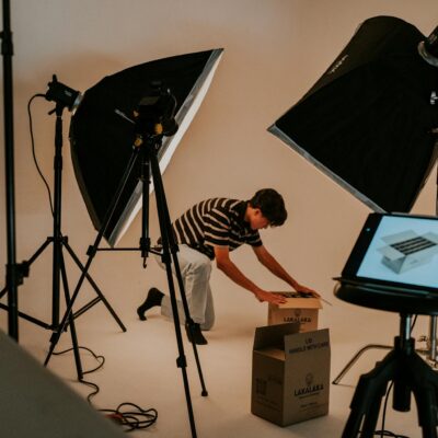 Studio Shot of a Man Unboxing a Package